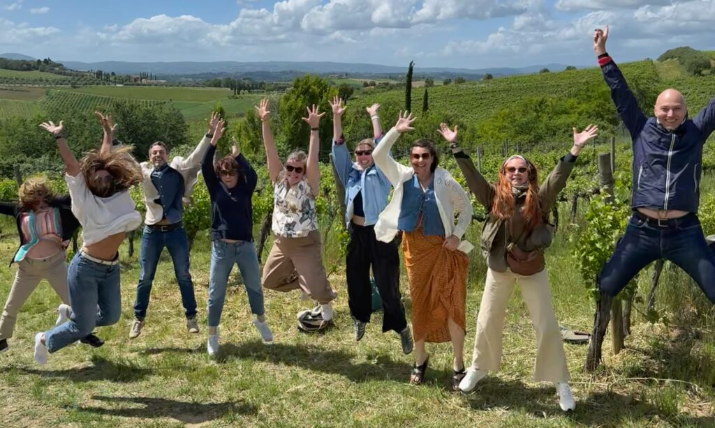 Group of travelers enjoying a private Tuscany wine tour in the vineyards, showing how the right itinerary creates a relaxed and memorable wine experience.